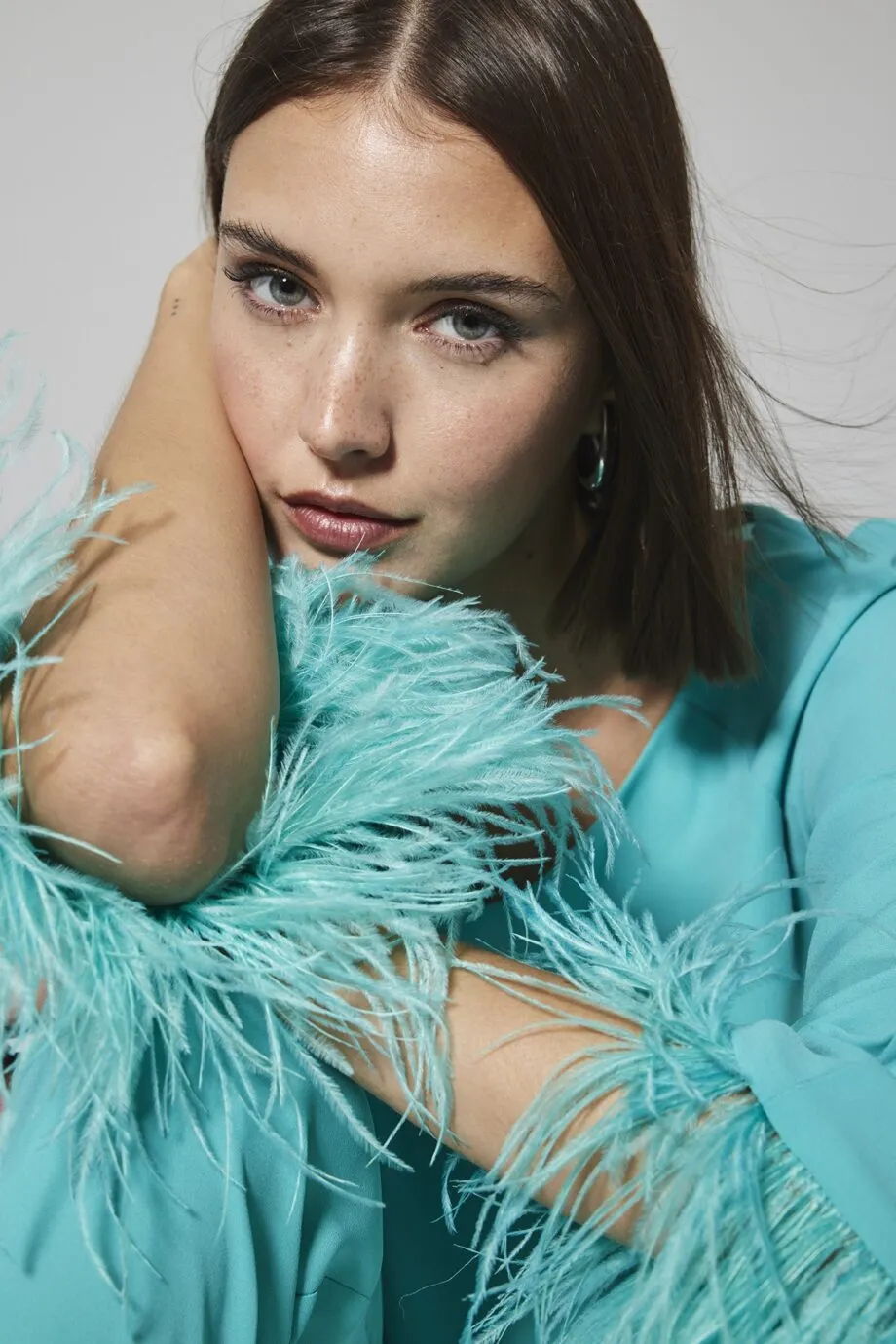 Arggido conjunto plumas turquesa
